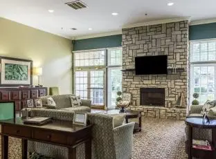 Common area with fireplace at American House Bartlett, a senior living community in Bartlett, Tennessee